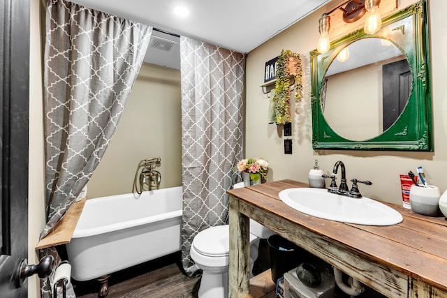 1939 E 540th Rd, Pleasant Hope, MO 65725 - bathroom with vanity, toilet, wood finished floors, and shower / tub combo
