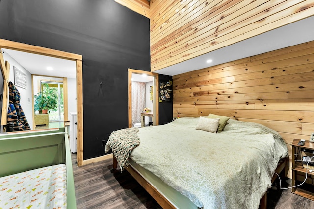 1939 E 540th Rd, Pleasant Hope, MO 65725 - bedroom featuring wood walls, a towering ceiling, and dark wood-style floors