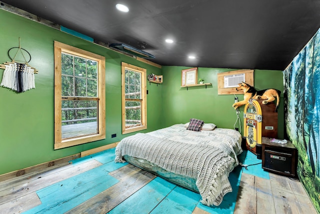 1939 E 540th Rd, Pleasant Hope, MO 65725 - bedroom featuring hardwood / wood-style floors, recessed lighting, and an AC wall unit