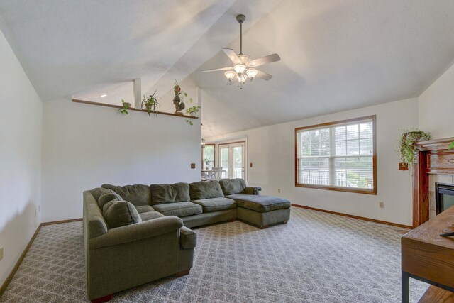 418 E Covington Rd, Willard, MO 65781 - living area with ceiling fan, a tile fireplace, carpet floors, baseboards, and high vaulted ceiling