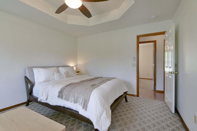 418 E Covington Rd, Willard, MO 65781 - carpeted bedroom featuring baseboards, a ceiling fan, and a tray ceiling
