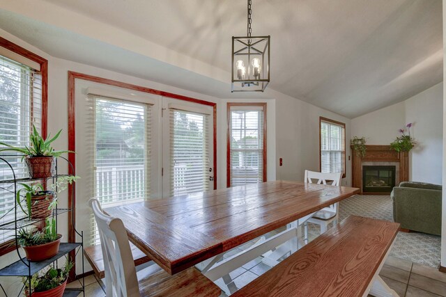 418 E Covington Rd, Willard, MO 65781 - dining space with vaulted ceiling, a glass covered fireplace, and a chandelier