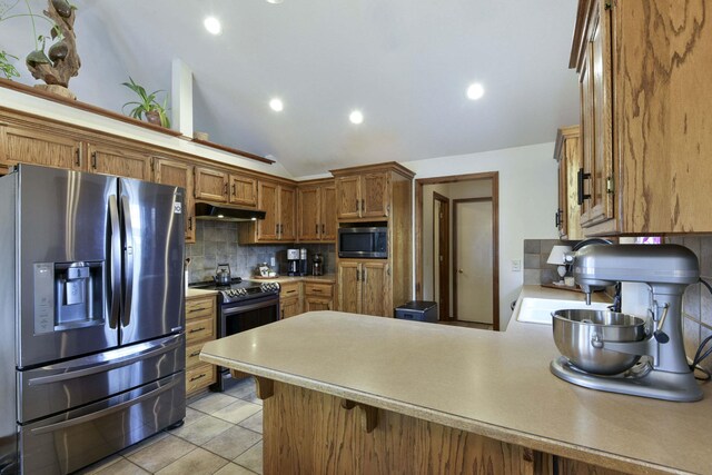 418 E Covington Rd, Willard, MO 65781 - kitchen featuring stainless steel appliances, under cabinet range hood, a peninsula, backsplash, and light countertops