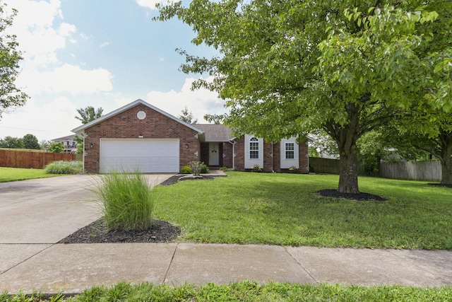 418 E Covington Rd, Willard, MO 65781 - view of front facade featuring brick siding, a garage, and concrete driveway