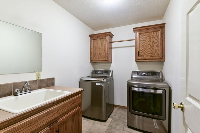 418 E Covington Rd, Willard, MO 65781 - laundry area featuring washer and clothes dryer and cabinet space