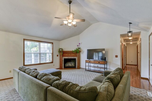 418 E Covington Rd, Willard, MO 65781 - living area featuring vaulted ceiling, ceiling fan, baseboards, wood finished floors, and a tiled fireplace