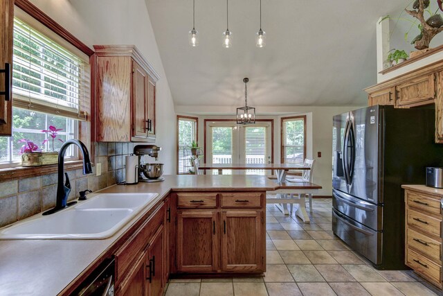 418 E Covington Rd, Willard, MO 65781 - kitchen with a sink, stainless steel fridge with ice dispenser, lofted ceiling, a peninsula, and plenty of natural light