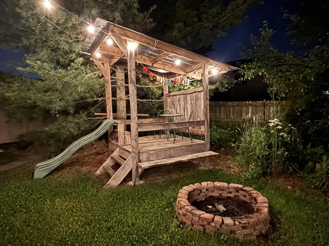 418 E Covington Rd, Willard, MO 65781 - deck at twilight featuring a fire pit