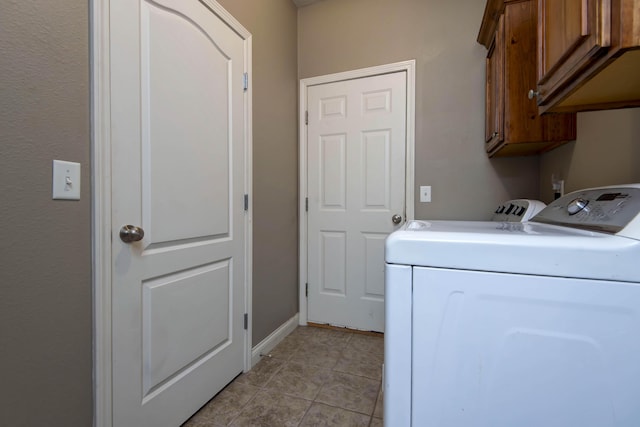 1214 Evington Ct, Springfield, MO 65803 - washroom featuring washer and dryer, cabinet space, light tile patterned floors, and baseboards