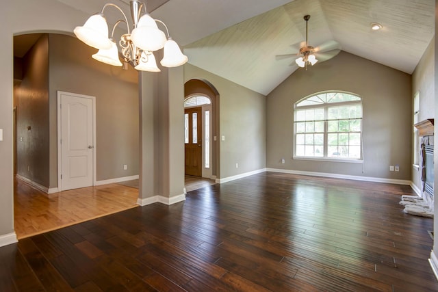 1214 Evington Ct, Springfield, MO 65803 - unfurnished living room with arched walkways, ceiling fan, a chandelier, hardwood / wood-style flooring, and lofted ceiling