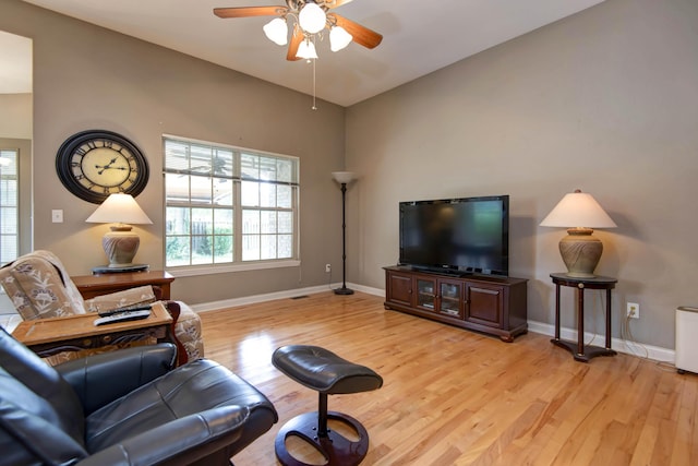 1214 Evington Ct, Springfield, MO 65803 - living room with a ceiling fan, light wood-style flooring, baseboards, and vaulted ceiling