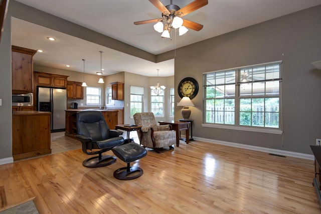 1214 Evington Ct, Springfield, MO 65803 - living area with light wood-style flooring, ceiling fan, a chandelier, baseboards, and recessed lighting