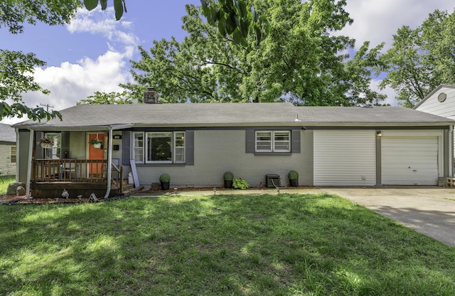 608 W University St, Springfield, MO 65807 - ranch-style home featuring driveway, a porch, an attached garage, a front yard, and a chimney