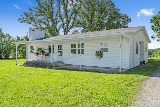 108 State Road Dd, Buffalo, MO 65622 - view of front of property with a front lawn, a chimney, a porch, and a shingled roof