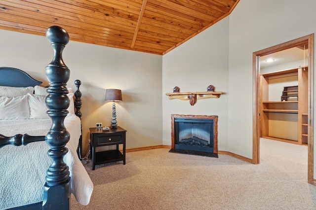 1041 Skyview Dr, Branson, MO 65616 - carpeted living area with wooden ceiling, lofted ceiling, baseboards, and a fireplace with flush hearth