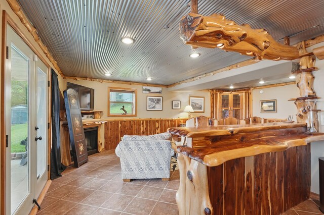 1041 Skyview Dr, Branson, MO 65616 - living area with tile patterned flooring, a fireplace, a wainscoted wall, wood ceiling, and recessed lighting