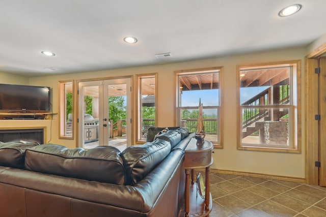 1041 Skyview Dr, Branson, MO 65616 - living room featuring recessed lighting, baseboards, french doors, and dark tile patterned flooring