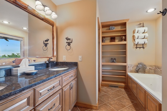 1041 Skyview Dr, Branson, MO 65616 - bathroom with double vanity, a tub with jets, tile patterned floors, and recessed lighting