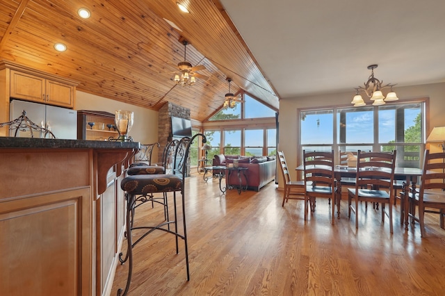 1041 Skyview Dr, Branson, MO 65616 - dining room with a chandelier, light wood finished floors, vaulted ceiling, and recessed lighting