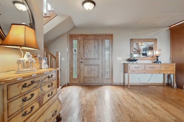 1041 Skyview Dr, Branson, MO 65616 - foyer entrance featuring light wood-style flooring, healthy amount of natural light, vaulted ceiling, and baseboards