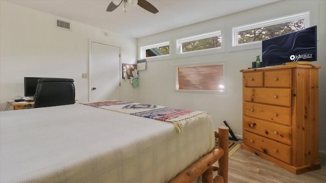 53 County Road 803a, Gainesville, MO 65655 - bedroom featuring wood finished floors, ceiling fan, and an office area