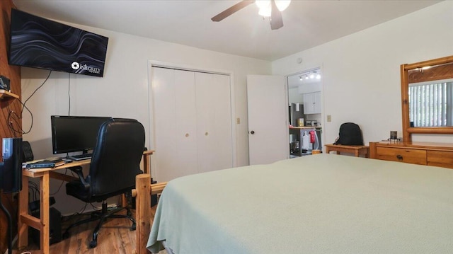 53 County Road 803a, Gainesville, MO 65655 - bedroom with wood finished floors, a closet, a desk, and ceiling fan