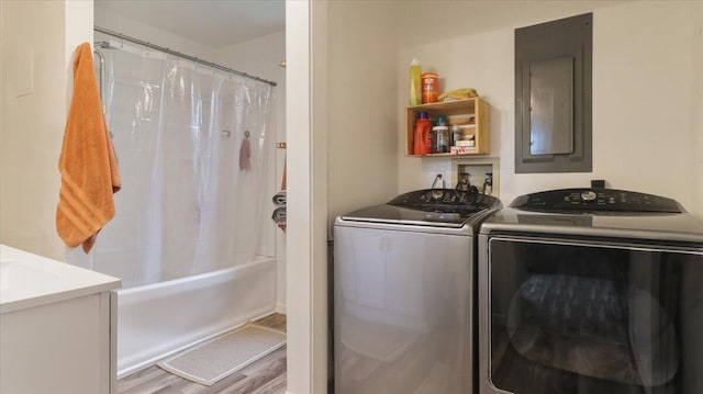 53 County Road 803a, Gainesville, MO 65655 - laundry room with washing machine and dryer, wood finished floors, and electric panel