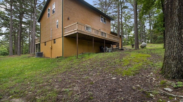 53 County Road 803a, Gainesville, MO 65655 - back of property with a wooden deck and central AC