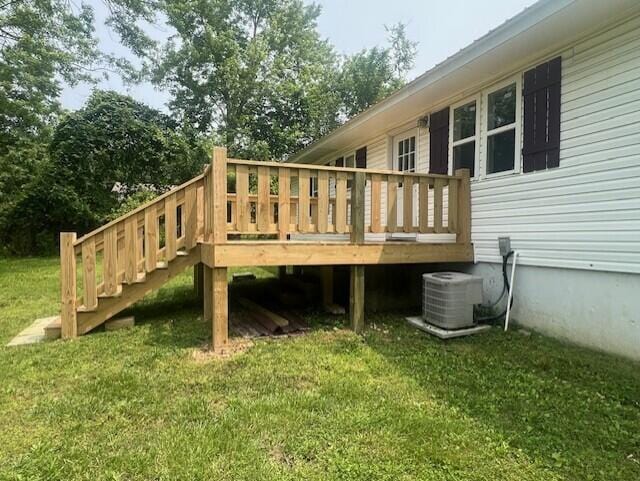 1217 Blair St, Cabool, MO 65689 - deck featuring central air condition unit and a yard