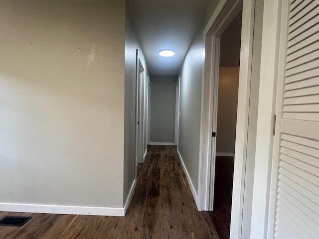1217 Blair St, Cabool, MO 65689 - hall featuring dark wood finished floors and baseboards