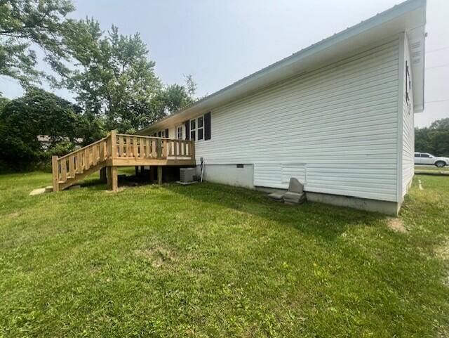1217 Blair St, Cabool, MO 65689 - rear view of property with a deck, a yard, crawl space, and stairs