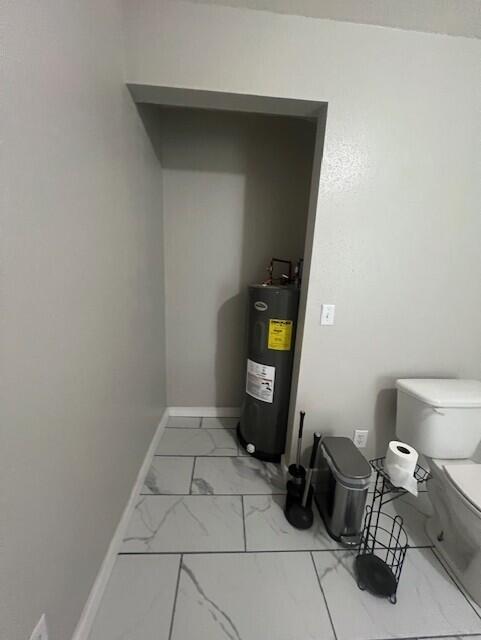 1217 Blair St, Cabool, MO 65689 - utility room featuring electric water heater
