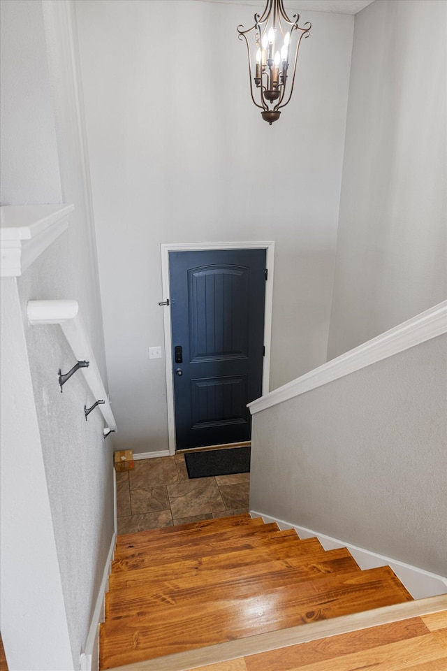 1311 Nitro Dr, Ozark, MO 65721 - staircase featuring a chandelier and baseboards