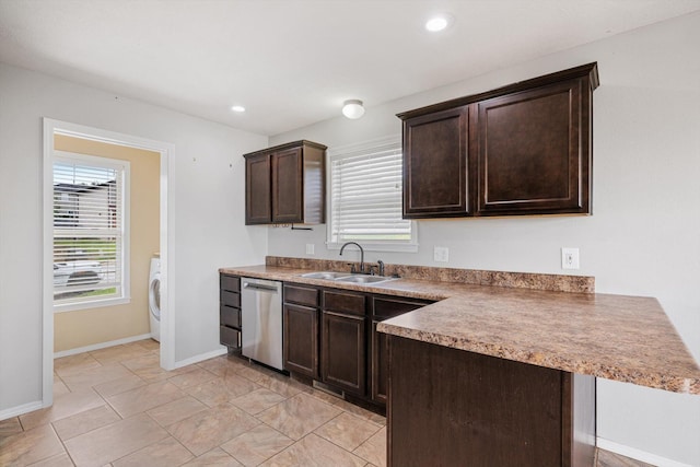 1311 Nitro Dr, Ozark, MO 65721 - kitchen with a sink, dishwasher, washer / clothes dryer, dark brown cabinetry, and a peninsula