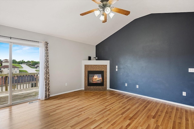 1311 Nitro Dr, Ozark, MO 65721 - unfurnished living room featuring lofted ceiling, ceiling fan, light wood-style flooring, a fireplace, and baseboards