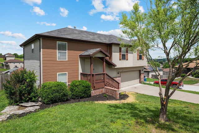 1311 Nitro Dr, Ozark, MO 65721 - split foyer home featuring an attached garage, driveway, a front lawn, and roof with shingles
