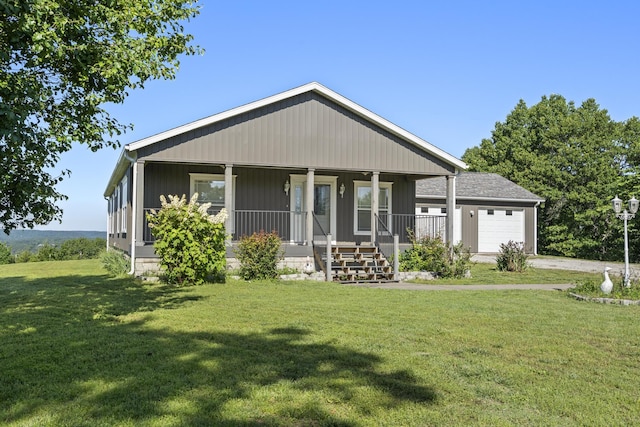 323 Shadrack Rd, Cape Fair, MO 65624 - view of front of house with covered porch, a front lawn, a garage, and concrete driveway