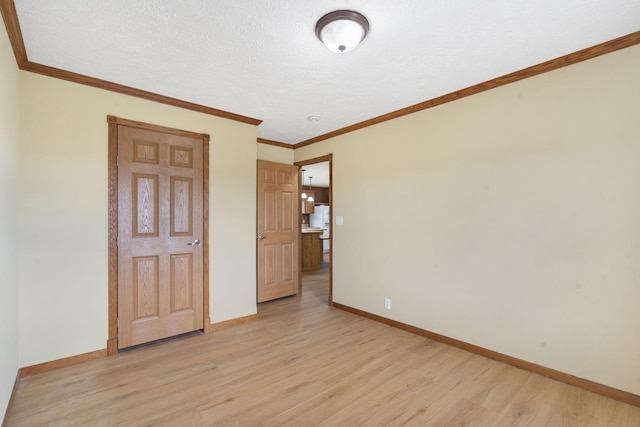 323 Shadrack Rd, Cape Fair, MO 65624 - empty room with light wood-style floors, baseboards, and ornamental molding