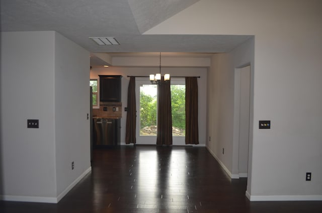 532 Holiday St, Highlandville, MO 65669 - spare room featuring baseboards, dark wood finished floors, a chandelier, and a textured ceiling