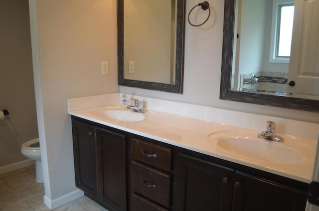 532 Holiday St, Highlandville, MO 65669 - full bathroom with toilet, double vanity, baseboards, and tile patterned flooring