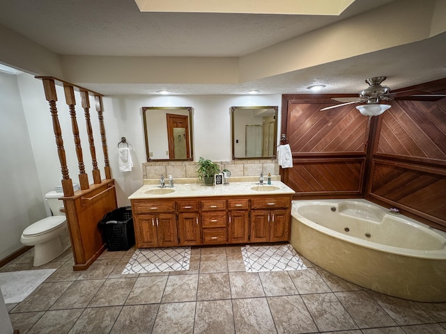 5350 E Farm Road 168, Rogersville, MO 65742 - full bath featuring double vanity, a jetted tub, toilet, ceiling fan, and decorative backsplash