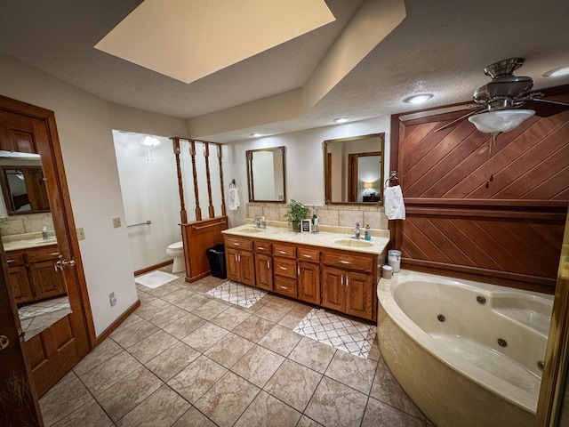 5350 E Farm Road 168, Rogersville, MO 65742 - bathroom with decorative backsplash, double vanity, toilet, and recessed lighting
