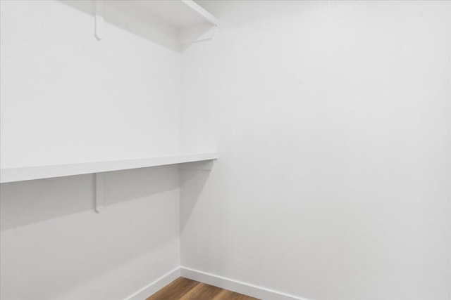 1239 W Arlington Ct, Springfield, MO 65803 - spacious closet with dark wood-style floors