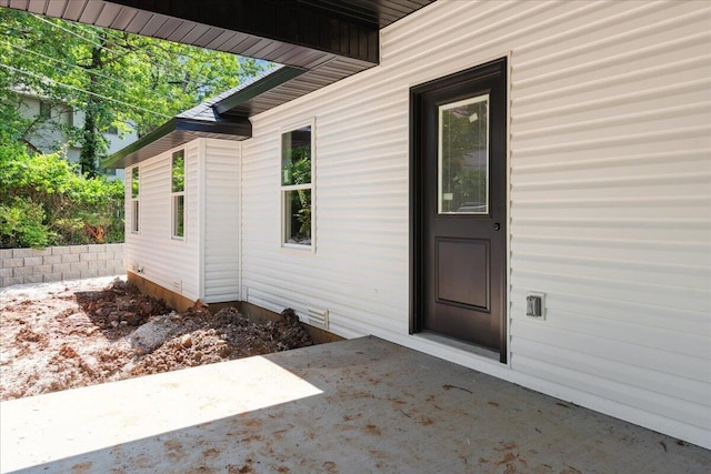 1239 W Arlington Ct, Springfield, MO 65803 - property entrance with a patio area
