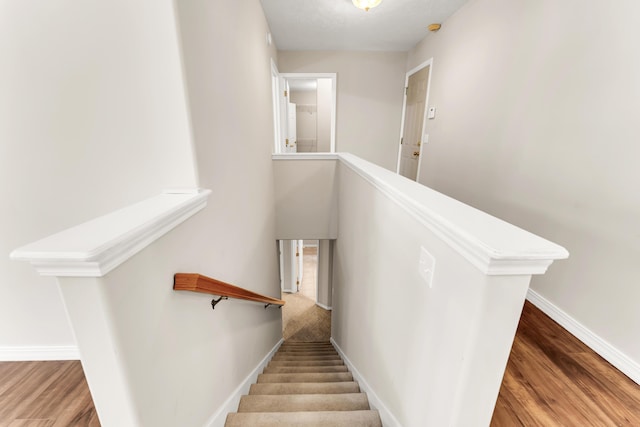 315 Rock Ridge Rd, Branson West, MO 65737 - staircase featuring wood finished floors and baseboards