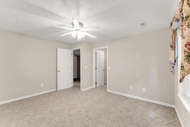 315 Rock Ridge Rd, Branson West, MO 65737 - unfurnished bedroom featuring light carpet, baseboards, a ceiling fan, and a textured ceiling