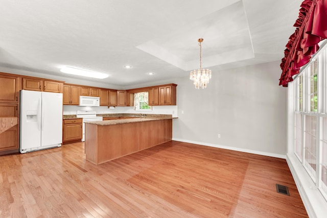 315 Rock Ridge Rd, Branson West, MO 65737 - kitchen featuring white appliances, light wood finished floors, a peninsula, baseboards, and a chandelier