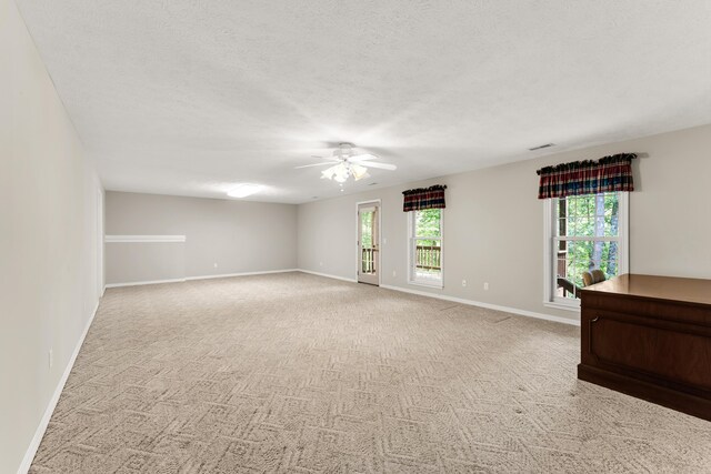 315 Rock Ridge Rd, Branson West, MO 65737 - empty room featuring ceiling fan, plenty of natural light, baseboards, and a textured ceiling