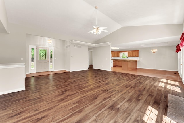315 Rock Ridge Rd, Branson West, MO 65737 - unfurnished living room with wood finished floors, a ceiling fan, vaulted ceiling, healthy amount of natural light, and a chandelier