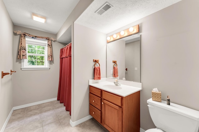 315 Rock Ridge Rd, Branson West, MO 65737 - full bathroom featuring vanity, toilet, a shower with curtain, tile patterned flooring, and a textured ceiling